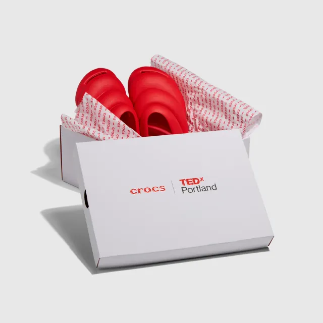 Crocs × TEDxPortland Steven Smith clogs in their box, wrapped in red-and-white tissue
