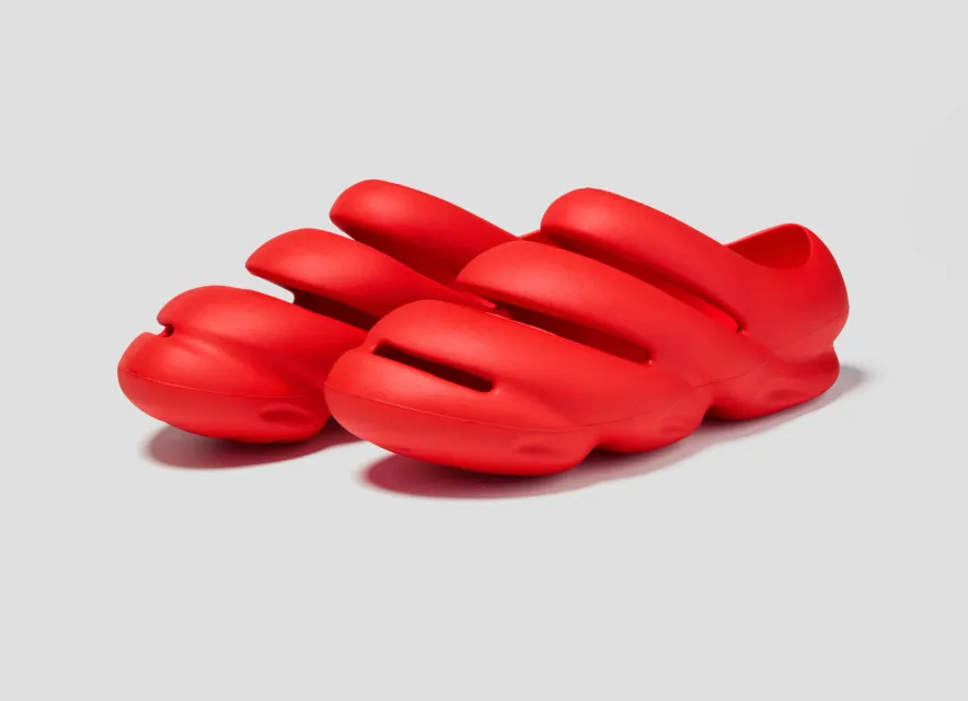 Pair of red Crocs × TEDxPortland Steven Smith clogs, three-quarter view