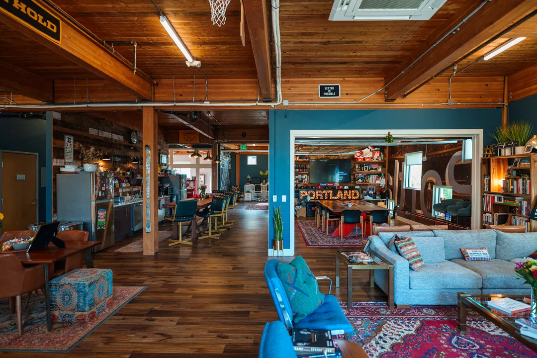 TEDxPortland HQ: the lounge seen from the entrance, hardwood floors and timber beams