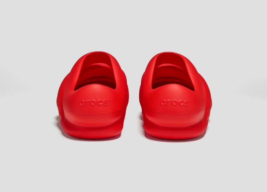 Pair of red Crocs × TEDxPortland Steven Smith clogs from behind, showing the crocs heel logo